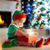 Toddler with open gift box