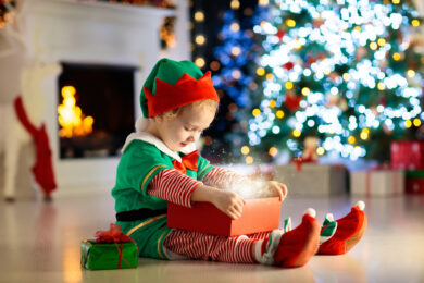 Toddler with open gift box